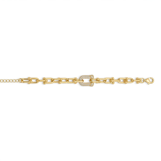 A gold chain bracelet featuring a central horseshoe-shaped link embellished with small clear stones, shown against a plain white background.